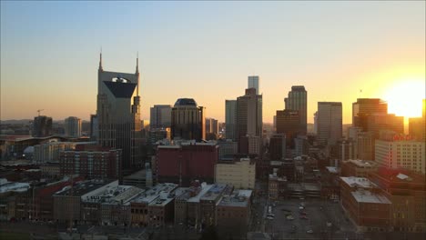 Flying-toward-downtown-Nashville-cityscape-during-sunset
