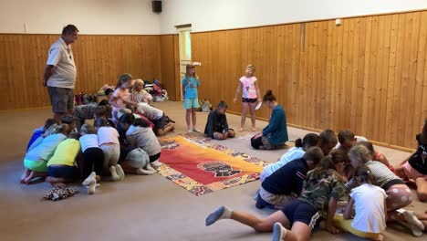 Children-solving-a-cipher-in-groups-at-a-the-summer-camp