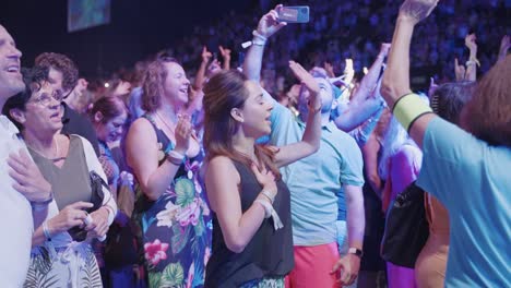 brown-haired-woman-is-dancing-in-a-big-crowd-of-people-having-a-good-time