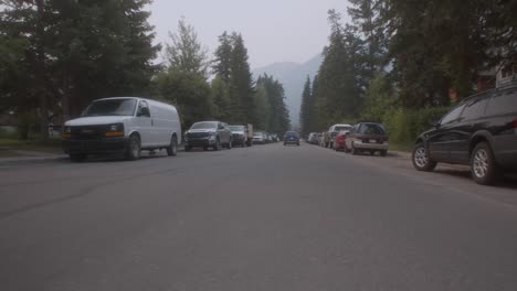 The-car-followed-as-passing-by-in-Mountain-town-street