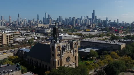 Chicago-USA,-Aerial-View-of-Cityscape-Skyline,-I-90-Highway-Traffic-and-Catholic-Church-in-Suburban-Neighborhood