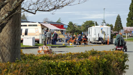 People-Gathering-Outdoor-Next-to-Food-Truck-and-Coffee-Van-in-Street,-Port-Alberni-British-Columbia-Canada