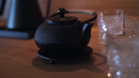 Small-old-looking-Japanese-tea-kettle-in-kitchen,-filmed-with-Panasonic-GH5-with-sigma-art-35mm-lens