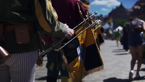 Individuals-in-a-marching-band-holding-the-trumpet-during-the-Wallenstein-Festspiele-in-Altdorf,-Bavaria