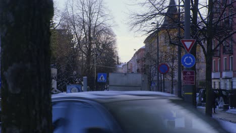 Oslo-busy-street-intersection,-train,-tramway,-cars-with-Tesla