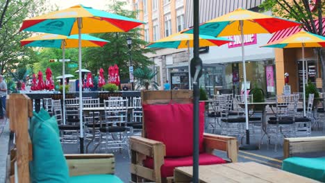 Outdoor-dining-space-with-empty-seats-on-George-Street-in-New-Brunswick-NJ-on-a-sunny-summer-evening