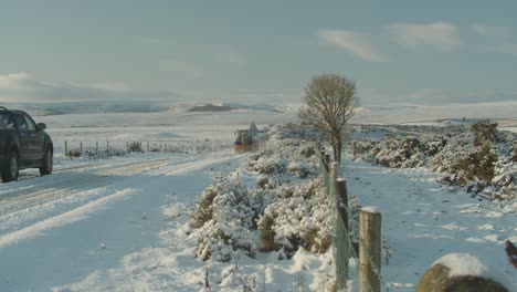 A-snow-plough-clearing-the-road-on-the-North-York-Moors,-between-Whitby-and-Guisborough