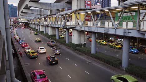 Skywalk-connecting-the-sky-train-station-on-the-main-road-in-Lat-Phrao-area,-Bangkok,-Thailand