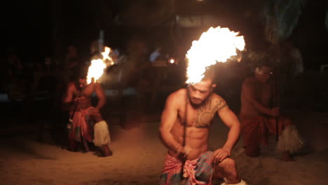 Group-of-Male-Performers-Fire-Dancing-at-a-Resort