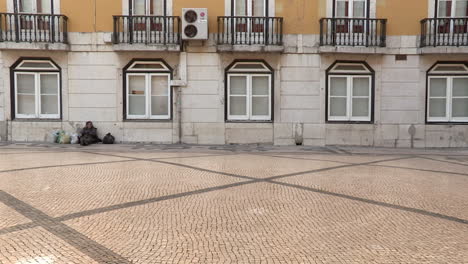 Two-young-people-put-on-a-street-show-on-their-unicycles,-combine-fun-and-sharpen-their-skills,-for-tourists-passing-by-Rua-Augusta