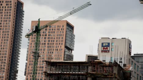 A-skyscrapers-under-construction-with-cranes-timelapse-in-Mexico-City,-Polanco-neighborhood-one-of-the-most-luxurious-neighborhoods-in-Mexico-City