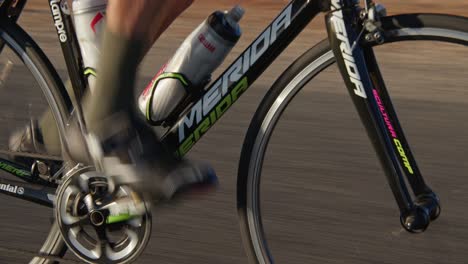 Close-up-tracking-shot-of-cyclist-pedaling