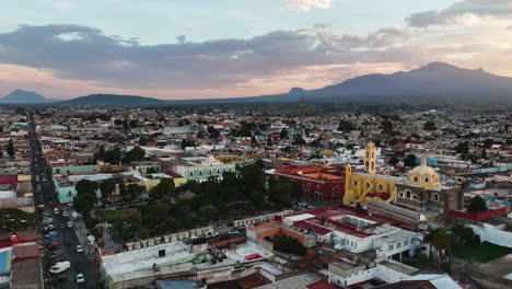 Panoramic-drone-shot-around-the-center-of-the-Huamantla-city,-sundown-in-Mexico