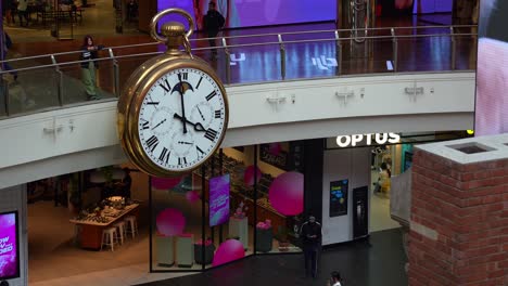 The-iconic-Melbourne-Central-Clock,-a-giant-pocket-watch-landmark-in-the-bustling-commercial-shopping-centre,-a-popular-meet-up-spot-in-the-city-for-local-people,-close-up-shot