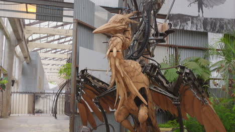 Tilt-down-shot-of-huge-automated-heron-on-display-in-the-Island-of-Nantes,-France-at-daytime