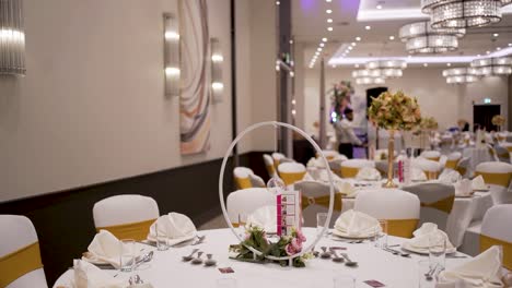 The-wedding-dinner-is-enhanced-by-fresh-flowers-and-stunning-lights-adorning-a-lovely-banquet-setting