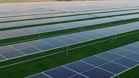 Rows-of-solar-panels-in-a-green-field-generating-renewable-energy-on-a-sunny-day