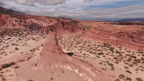 Aerial-view-of-a-natural-Obelisco,-striking-red-rock-formations-in-the-Calchaquí-valley,-in-Salta-province,-Argentina