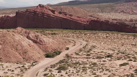 Aerial-View-Of-The-Road-With-A-Car-At-Salta-Argentina,-Calchaquí-Valley,-Las-Ventanas,