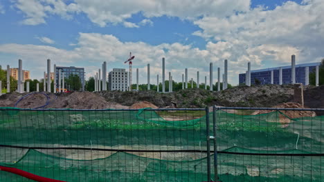 Construction-site-fence,-work-in-progress-engineering-project-steel-foundation-pillars