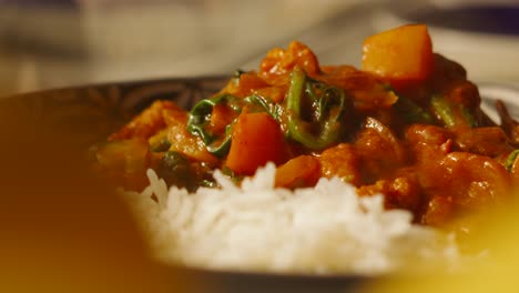 Delicious-Indian-Cuisine-Vegetable-Tikka-Masala-Curry-with-Cauliflower,-Spinach,-Peppers-and-Traditional-Basmati-Rice---4K-Footage