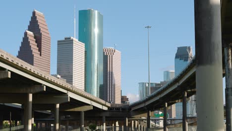 Establishing-shot-of-downtown-Houston-from-freeway-underpass