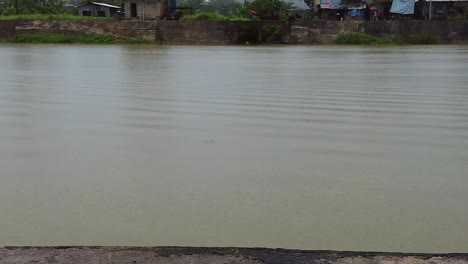 Rainy-season,-dull-overcast-day-as-rain-falls-on-the-Surigao-River-with-a-depressing-atmosphere