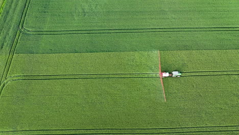 Aerial-view-of-a-crop-duster-spraying-a-field