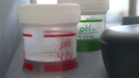 Laboratory-jars-with-liquid-indicating-the-acid-number-in-pH