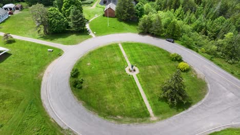 Aerial-approaching-view-of-John-Brown-Farm-Historic-Site-in-North-Elba,-NY