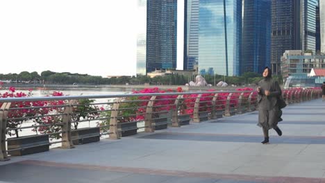 Young-Asian-Muslim-Woman-Wear-Hijab-Running-Or-Jogging-In-The-Morning-At-Modern-City