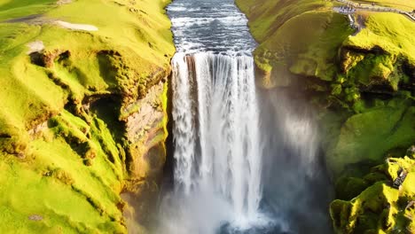 Beauty-of-a-magnificent-waterfall-cascading-through-a-lush-green-landscape-in-Iceland