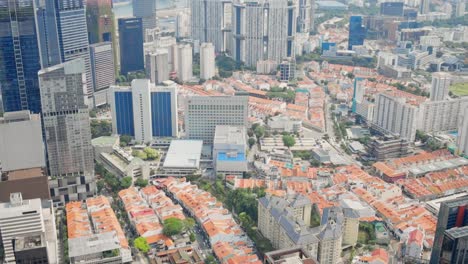 Aerial-Drone-Shot-Of-City-With-Residential-Housing,-Apartment-Towers-And-Skyscrapers-Buildings