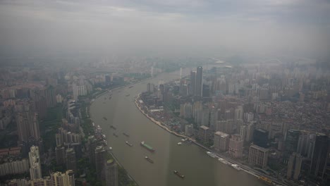 Boats-navigating-Huangpu-River-in-Shanghai,-China