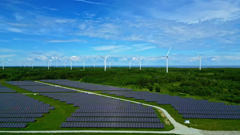 Aerial-of-Solar-panel-sun-array-electricity-and-wind-farm-park,-green-energy