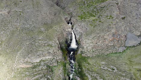 Aerial-wide-angle-view-of-waterfall-in-the-mountains