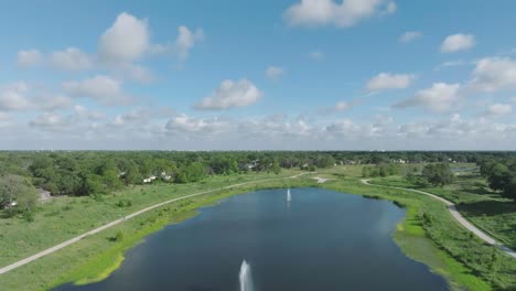 An-aerial-drone-view-of-bicycle-riders-and-walkers-in-Exploration-Green-in-Clear-Lake,-Houston,-Texas