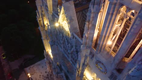 Night-view-of-a-Gothic-church-in-Vienna,-Austria,-showcasing-illuminated-intricate-details-and-spires