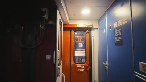 Point-of-view-of-entering-a-train-wagon-in-the-Netherlands-showing-the-doors-and-windows