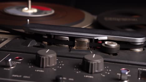 Reel-to-Reel-Audio-Tape-Rolling-During-Playback-or-Recording-in-Vintage-Magnetophone,-Close-Up