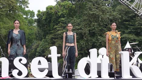 Fashion-models-standing-on-stage-at-an-outdoor-concert-event-during-the-day,-Bogor,-Indonesia