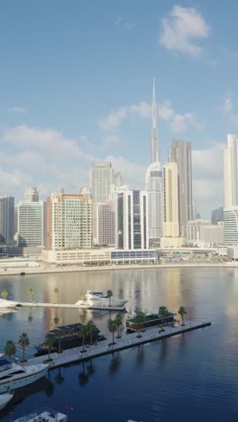 Vertical-footage-panoramic-view-of-Dubai-Business-Bay-on-sunny-day