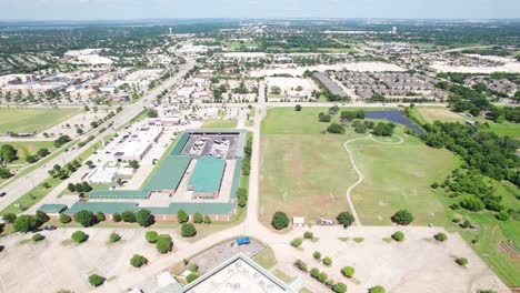 Aerial-footage-of-Flower-Mound-Texas-with-various-buildings-and-businesses