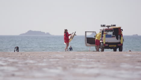 RNLI-lifeguards-on-Treyarnon-Bay-in-Cornwall-on-duty,-static-shot