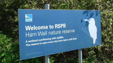 Welcome-to-RSPB-Ham-Wall-nature-reserve-entrance-sign-on-the-Somerset-Levels-in-England-UK