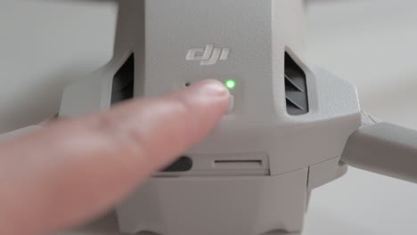 Closeup-shot-of-drone-pressing-shutdown-button