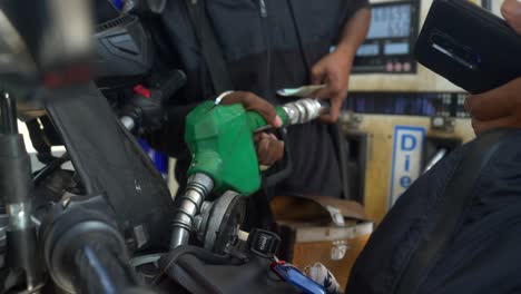 Closeup-of-refilling-petrol-on-motorbike-at-Indian-Oil-station