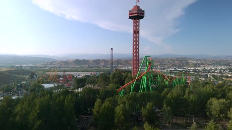 Drone-rising-around-the-Sky-tower-at-the-Six-Flags-Magic-Mountain-park-in-CA,-USA