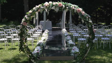 Experience-the-enchanting-beauty-of-a-floral-altar-on-a-wedding-day,-exuding-elegance-and-romance-to-enhance-the-ceremonial-ambiance