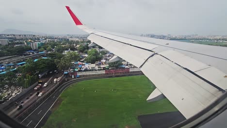 The-view-from-an-airplane-window-on-the-wing-and-a-working-an-engine